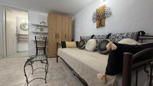 a living room with a couch and a chair at Arena's nest in Áyioi Dhéka
