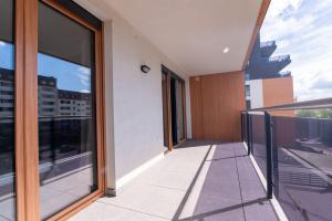a balcony with a view of a building at Apartament 20 in Mysłowice
