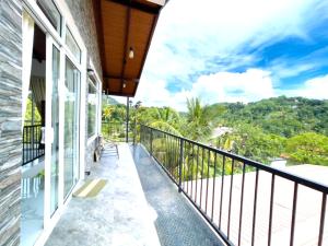 a balcony with a view of the mountains at The Mulberry Villa kandy in Kandy