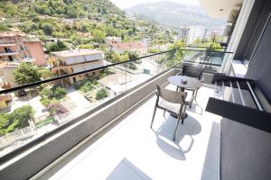 a balcony with a view of a city at Hotel Digreis in Vlorë