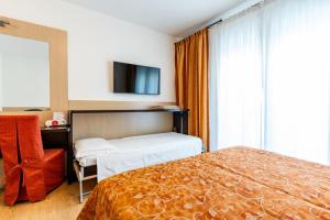 Кровать или кровати в номере Hotel Olympus +90 фотографий