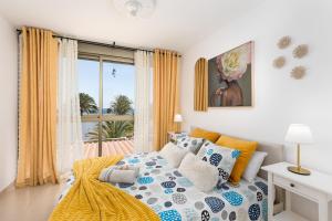 a bedroom with a bed with a view of the ocean at CarpeDiem Costa de Antigua in Costa de Antigua +25 photos