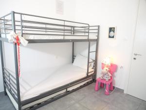 a bunk bed room with two bunk beds and a table at Kassiani Studios in Keramoti