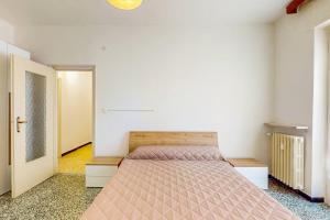 a bedroom with a bed in a room at [DolciAcque] Dolce sosta nel cuore di Acqui in Acqui Terme