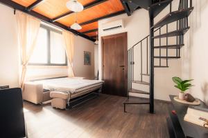 a bedroom with a bed and a staircase in it at Residenza Michetti in Francavilla al Mare