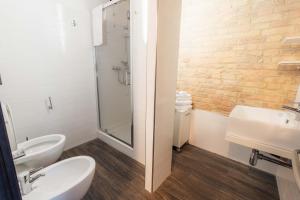 a bathroom with a toilet and a sink and a shower at Residenza Michetti in Francavilla al Mare