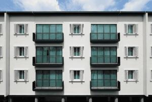an apartment building with many windows at Link Hotel Singapore in Singapore