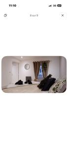a room with a bed and a mirror at T2 Chaleureux in Vals-les-Bains