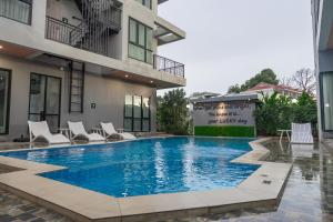 a swimming pool in the middle of a building at The Lucky Beach Ao Nang in Ao Nang Beach