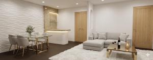 a living room with a couch and a table at Anantita Poolside Boutique in Phra Nakhon Si Ayutthaya