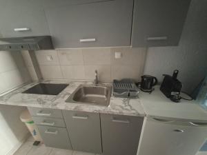 a kitchen with a sink and a counter top at Tassos 2 in Pefkochori +32 photos