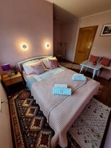 a bedroom with a large bed with two pillows on it at Nensi in Mostar +8 photos