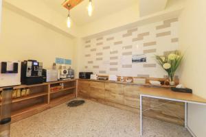 a coffee shop with a counter with flowers on it at 통영호텔조선 in T'ongyŏng
