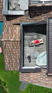 a model of a woman laying on a deck at Granpanorama Hotel StephansHof in Villandro