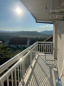 a balcony with a view of the mountains at Apartman Šarenac in Bileća