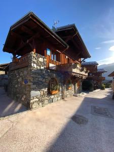 a large stone building with a stone oven at L'edelweiss in La Plagne Tarentaise