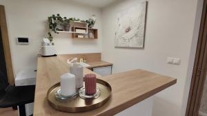 a kitchen with a wooden counter top and a table at Sunrise House in Žilina