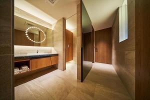 a bathroom with a sink and a mirror at The Blue House in Katsuura +58 photos