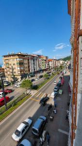 a city street with cars parked in a parking lot at Trabzon Zingila Residence in Yomra +3 photos