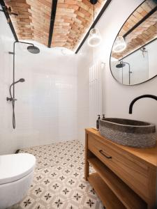 a bathroom with a sink and a mirror at Šimuntov dvor in Nová Baňa