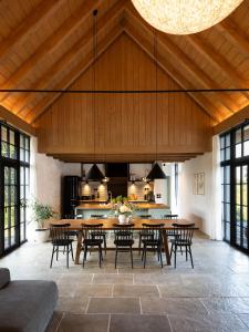 a large dining room with a table and chairs at Šimuntov dvor in Nová Baňa +19 photos