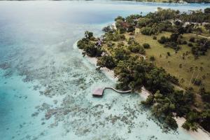 an aerial view of an island in the water at Ratua Private Island Resort in Aimbuei Bay