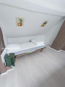 a room with a bed in the corner of a room at La Courée d'Orchies in Loos