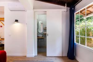 a room with a mirror and a window at Penedo Escape Nature in Colares +84 photos