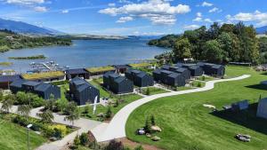 an aerial view of a village next to a lake at Rekreačné domy Marina Cabin House in Bobrovník