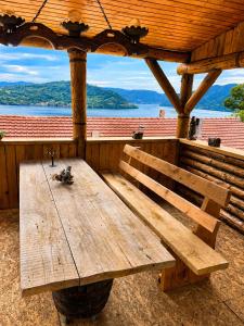 a wooden bench sitting inside of a wooden cabin at Best view house in Orşova