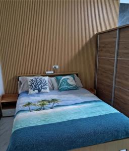 a bedroom with a bed with pillows on it at City View Studio Pool - Gym - Caesar Residence in Mactan Island +18 photos