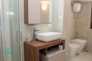 a bathroom with a sink and a toilet at Roan Home Pompei 2 in Pompei