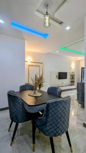 a dining room with a table and chairs at Little Afrika in Port Harcourt