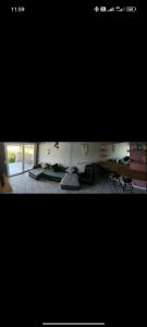 a picture of a living room with a fireplace at villa sun view in Peratiá