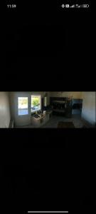 a picture of a kitchen with two windows at villa sun view in Peratiá
