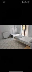 a room with two beds and a window at villa sun view in Peratiá +24 photos