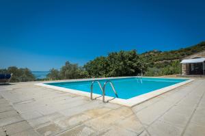 a swimming pool in the middle of a patio at PoloTuristicoUmbria Rustico con Piscina Vista Lago in Passignano sul Trasimeno