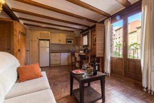 a living room with a couch and a table at Hotel Apartamentos Melihah in Daroca