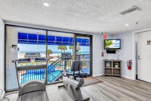 a gym with a view of the ocean at Caprice 401 in St. Pete Beach