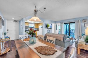a living room with a couch and a table at Caprice 501 in St. Pete Beach