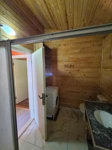 a bathroom with a toilet and a sink at Azra Villas in Cıralı