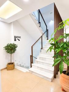 a staircase in a building with plants at Hotel Córdoba Centro in Córdoba