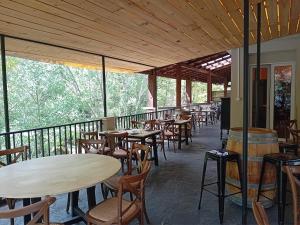 a row of tables and chairs on a balcony at Le Terminus in Ax-les-Thermes