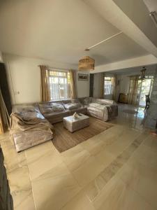 a large living room with a couch and a table at Casa Lotus in Pereybere +25 photos