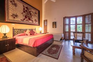 a bedroom with a large bed in a room at The Notary's House in Makandura