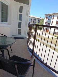 a balcony with a table and a table and chairs at Studio apartman Relax in Sanski most