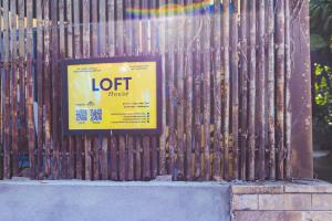 a sign on a metal fence with a lot house at Loft House 2BR Beachside An Bang Beach Hoi An by Beachside Boutique Homes in An Bàn (2) +14 photos