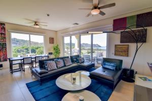 a living room with a couch and a table at Miramar 5B 2 bdr Ocean View in Los Suenos in Herradura