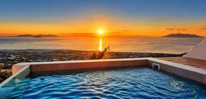 a hot tub with a view of the sunset at Martynou View in Pyrgos +102 photos