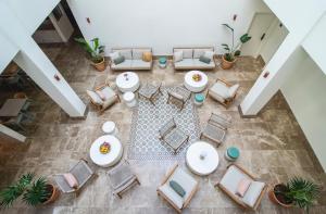 an overhead view of a living room with chairs and tables at Hotel Estepona Patio in Estepona